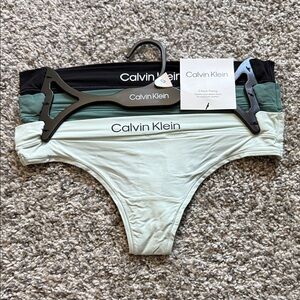 Calvin Klein Thong Trio in Black, Green, and Cream